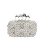 Alexander McQueen Women's knuckle clutch in white.