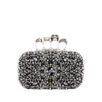 Alexander McQueen Women's knuckle clutch in black.