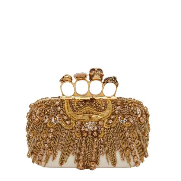 Alexander McQueen Women's knuckle clutch in gold.