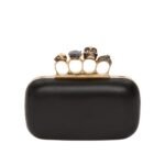 Alexander McQueen Women's knuckle clutch with chain in black.