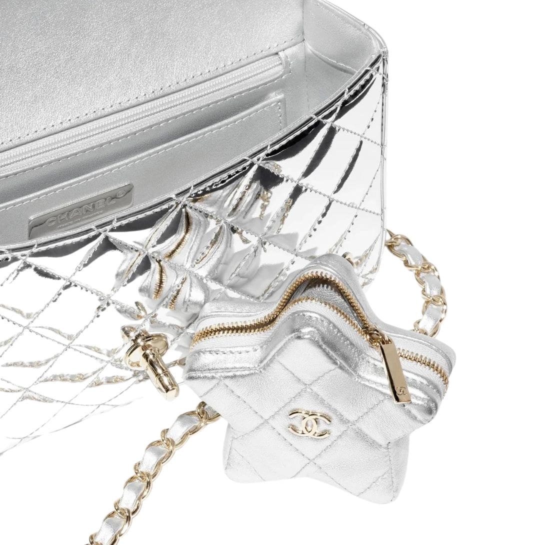 "Discover timeless elegance with Chanel's iconic Flap Bag & Star Coin Purse. Elevate your style with luxury craftsmanship and Parisian chic. Shop now!"