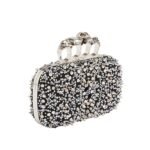 Alexander McQueen Women's knuckle clutch in black.