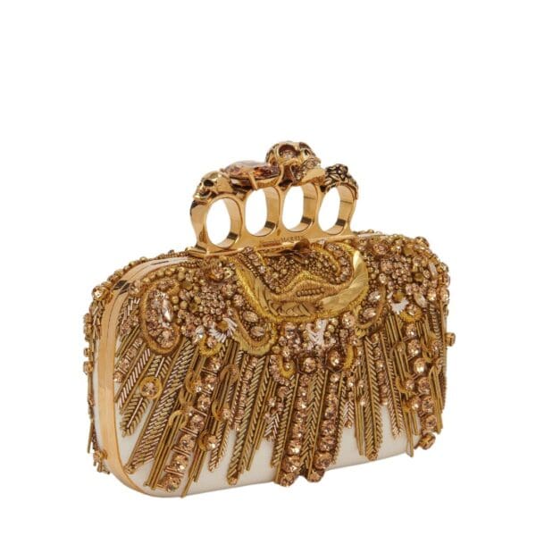 Alexander McQueen Women's knuckle clutch in gold.