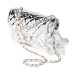 "Discover timeless elegance with Chanel's iconic Flap Bag & Star Coin Purse. Elevate your style with luxury craftsmanship and Parisian chic. Shop now!"