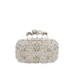 Alexander McQueen Women's knuckle clutch in white.