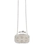 Alexander McQueen Women's knuckle clutch in white.