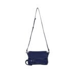 Indulge in understated elegance with the Beacon Saddle Bag in Suede, a captivating creation that pays homage to the rugged charm of traditional workwear satchels. Crafted from sumptuously supple suede in a deep, alluring dark blue hue, this accessory embodies sophistication and refinement while embracing its utilitarian inspiration. The Beacon Saddle Bag in Suede is a testament to the brand's dedication to superior craftsmanship and meticulous attention to detail. The supple suede material lends a luxurious touch to the design, inviting touch and admiration with its velvety texture and rich color. At the forefront of the design are the signature belted straps adorned with a distinguished D-ring buckle, securing the fold-over flap with both practicality and style. Inspired by the functionality of workwear satchels, these straps add a touch of rugged elegance to the bag while ensuring the safety of your belongings. Versatility is key with the adjustable shoulder strap, allowing you to effortlessly transition from day to night with ease and comfort. Whether worn crossbody for hands-free convenience or elegantly draped over the shoulder, this thoughtful addition ensures that the bag complements your every movement with grace and style. Practicality meets sophistication with the inclusion of a zip top fastening, providing secure closure for your essentials, while a zip back pocket offers convenient access to items on the go. Inside, an internal zip pocket further enhances organization, keeping your belongings neatly stowed within the spacious interior. Elevating the bag's aesthetic appeal are silver-tone metal hardware accents, adding a touch of modernity and refinement to its timeless design. From the precise stitching to the polished hardware, each detail is meticulously executed, reflecting the brand's dedication to impeccable craftsmanship and quality. In essence, the Beacon Saddle Bag in Suede epitomizes the perfect blend of classic elegance and contemporary sophistication. With its exquisite craftsmanship, thoughtful design, and enduring appeal, it stands as a testament to the brand's commitment to timeless style and impeccable quality, inviting you to elevate your ensemble with effortless sophistication and grace.