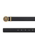 The Versace Medusa Biggie Enamel Leather Belt is a luxurious fusion of iconic design and superior craftsmanship, embodying the essence of opulence and sophistication that defines the renowned Italian fashion house. Crafted with meticulous attention to detail, this exquisite accessory exudes a sense of power and glamour, making it a standout piece in any wardrobe. At the heart of the design lies the striking emblem of Versace: the mythological Medusa head. Symbolizing strength, beauty, and allure, the Medusa motif commands attention with its intricate enamel detailing and bold presence. Positioned prominently on the belt buckle, it serves as a symbol of status and prestige, reflecting the brand's heritage of extravagance and allure. The belt itself is expertly crafted from premium leather, renowned for its supple texture and enduring quality. Smooth to the touch, yet durable enough to withstand the test of time, the leather exudes sophistication and refinement, elevating any ensemble with its luxurious feel. Measuring 4 cm in width, the belt strikes the perfect balance between statement-making style and everyday versatility. Whether cinched around the waist of a tailored suit or worn casually with jeans, it adds a touch of Italian glamour to any look, effortlessly elevating your personal style. Versatility meets elegance in the design of this accessory, with its timeless black leather complemented by gold-tone hardware. The rich contrast between the deep hue of the leather and the gleaming metallic accents creates a visually striking aesthetic, ensuring that the belt becomes the focal point of any outfit. More than just a fashion accessory, the Versace Medusa Biggie Enamel Leather Belt is a symbol of sartorial excellence and refined taste. With its iconic design, impeccable craftsmanship, and undeniable allure, it embodies the essence of the Versace brand, offering a timeless expression of luxury for the modern connoisseur.