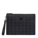 Enter the realm of refined elegance with the medium-sized zip pouch, a consummate clutch that seamlessly marries maximalist form with real-world functionality. Crafted with meticulous attention to detail, this accessory stands as a testament to the enduring allure of signature Visetos monogram canvas and sumptuous nappa leather. Measuring approximately 2.0 x 11.8 x 8.5 inches, this zip pouch strikes the perfect balance between spaciousness and sleekness, offering ample room for your essentials while maintaining a sophisticated silhouette that exudes timeless charm. The detachable leather wristlet strap, with a strap drop of 7.9 inches, provides hands-free wear, allowing for effortless transitions from day to night with ease and grace. Exemplifying the brand's commitment to quality craftsmanship, this zip pouch features the iconic MCM logo plate, a symbol of prestige and excellence. The zip closure ensures the security of your belongings while maintaining easy accessibility, providing peace of mind as you navigate your day. Inside, the pouch boasts an interior zip pocket, thoughtfully designed to keep your valuables organized and within reach. The nylon lining adds a touch of luxury while providing durability and protection for your belongings, ensuring they remain pristine throughout your journeys. Crafted from the finest materials, including Visetos monogram canvas and nappa leather trim, this zip pouch exudes sophistication and refinement. Matte black metal hardware accents the pouch's aesthetic with a modern edge, elevating its allure to new heights. Handcrafted with care in South Korea, each zip pouch is a testament to meticulous craftsmanship and dedication to excellence, promising a seamless fusion of style and functionality. Whether used as a standalone accessory or as part of a larger ensemble, this pouch is sure to make a statement, exuding timeless elegance and effortless sophistication wherever you go.