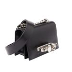 Alexander McQueen Women's The Biker Mini Jewelled Satchel in Black: An edgy, stylish satchel adorned with jewels, perfect for adding a bold touch to any outfit.