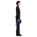 Indulge in understated elegance with the Beacon Saddle Bag in Suede, a captivating creation that pays homage to the rugged charm of traditional workwear satchels. Crafted from sumptuously supple suede in a deep, alluring dark blue hue, this accessory embodies sophistication and refinement while embracing its utilitarian inspiration. The Beacon Saddle Bag in Suede is a testament to the brand's dedication to superior craftsmanship and meticulous attention to detail. The supple suede material lends a luxurious touch to the design, inviting touch and admiration with its velvety texture and rich color. At the forefront of the design are the signature belted straps adorned with a distinguished D-ring buckle, securing the fold-over flap with both practicality and style. Inspired by the functionality of workwear satchels, these straps add a touch of rugged elegance to the bag while ensuring the safety of your belongings. Versatility is key with the adjustable shoulder strap, allowing you to effortlessly transition from day to night with ease and comfort. Whether worn crossbody for hands-free convenience or elegantly draped over the shoulder, this thoughtful addition ensures that the bag complements your every movement with grace and style. Practicality meets sophistication with the inclusion of a zip top fastening, providing secure closure for your essentials, while a zip back pocket offers convenient access to items on the go. Inside, an internal zip pocket further enhances organization, keeping your belongings neatly stowed within the spacious interior. Elevating the bag's aesthetic appeal are silver-tone metal hardware accents, adding a touch of modernity and refinement to its timeless design. From the precise stitching to the polished hardware, each detail is meticulously executed, reflecting the brand's dedication to impeccable craftsmanship and quality. In essence, the Beacon Saddle Bag in Suede epitomizes the perfect blend of classic elegance and contemporary sophistication. With its exquisite craftsmanship, thoughtful design, and enduring appeal, it stands as a testament to the brand's commitment to timeless style and impeccable quality, inviting you to elevate your ensemble with effortless sophistication and grace.