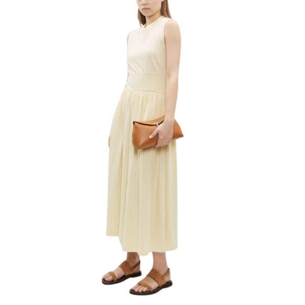 LA GARCONNE T-LOCK CLUTCH — TAN