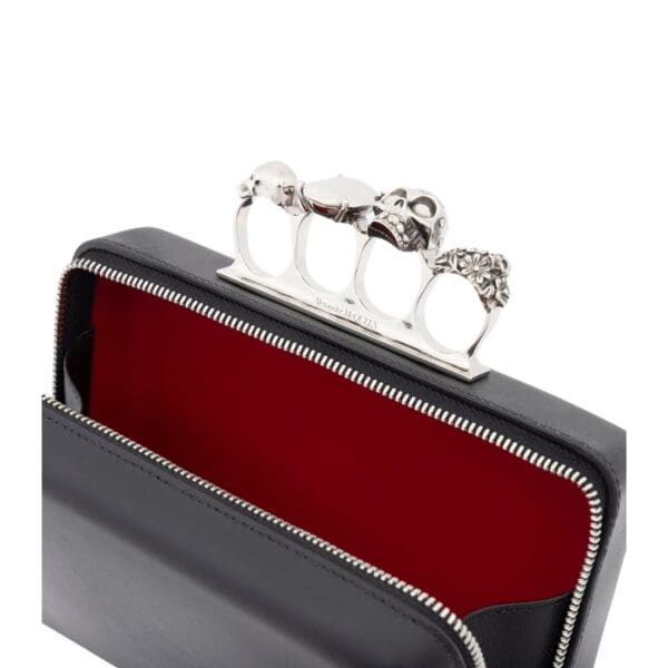 ALEXANDER MCQUEEN MANS THE KNUCKLE TWISTED CLUTCH IN BLACK