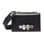 Alexander McQueen Women's The Biker Mini Jewelled Satchel in Black: An edgy, stylish satchel adorned with jewels, perfect for adding a bold touch to any outfit.