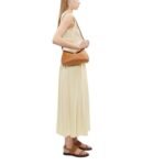 LA GARCONNE T-LOCK CLUTCH — TAN