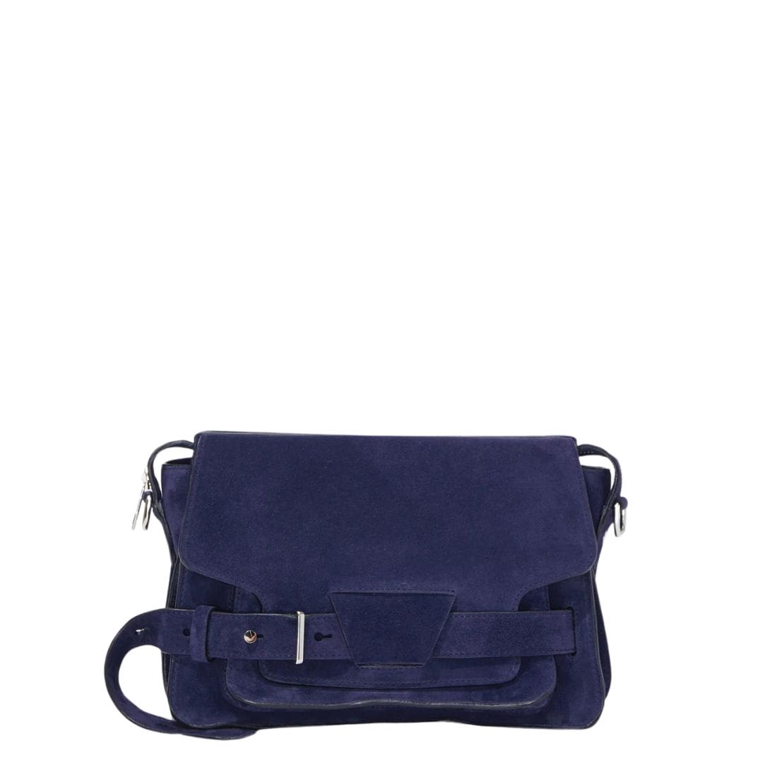 Indulge in understated elegance with the Beacon Saddle Bag in Suede, a captivating creation that pays homage to the rugged charm of traditional workwear satchels. Crafted from sumptuously supple suede in a deep, alluring dark blue hue, this accessory embodies sophistication and refinement while embracing its utilitarian inspiration. The Beacon Saddle Bag in Suede is a testament to the brand's dedication to superior craftsmanship and meticulous attention to detail. The supple suede material lends a luxurious touch to the design, inviting touch and admiration with its velvety texture and rich color. At the forefront of the design are the signature belted straps adorned with a distinguished D-ring buckle, securing the fold-over flap with both practicality and style. Inspired by the functionality of workwear satchels, these straps add a touch of rugged elegance to the bag while ensuring the safety of your belongings. Versatility is key with the adjustable shoulder strap, allowing you to effortlessly transition from day to night with ease and comfort. Whether worn crossbody for hands-free convenience or elegantly draped over the shoulder, this thoughtful addition ensures that the bag complements your every movement with grace and style. Practicality meets sophistication with the inclusion of a zip top fastening, providing secure closure for your essentials, while a zip back pocket offers convenient access to items on the go. Inside, an internal zip pocket further enhances organization, keeping your belongings neatly stowed within the spacious interior. Elevating the bag's aesthetic appeal are silver-tone metal hardware accents, adding a touch of modernity and refinement to its timeless design. From the precise stitching to the polished hardware, each detail is meticulously executed, reflecting the brand's dedication to impeccable craftsmanship and quality. In essence, the Beacon Saddle Bag in Suede epitomizes the perfect blend of classic elegance and contemporary sophistication. With its exquisite craftsmanship, thoughtful design, and enduring appeal, it stands as a testament to the brand's commitment to timeless style and impeccable quality, inviting you to elevate your ensemble with effortless sophistication and grace.