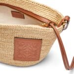 LOEWE SLIT CLUTCH BAG IN RAFFIA