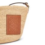 LOEWE SLIT CLUTCH BAG IN RAFFIA