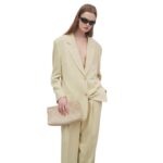 THE ROW REMI CLUTCH IN STRAW