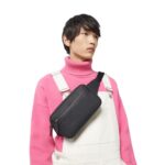 GUCCI GG RUBBER-EFFECT BELT BAG IN BLACK