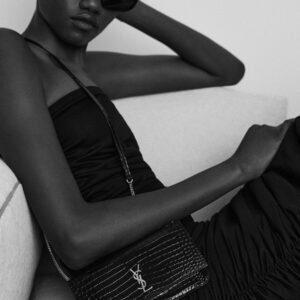 CASSANDRE PHONE HOLDER IN SHINY CROCODILE EMBOSSED LEATHER