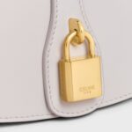 CLUTCH ON STRAP TABOU IN SMOOTH CALFSKIN